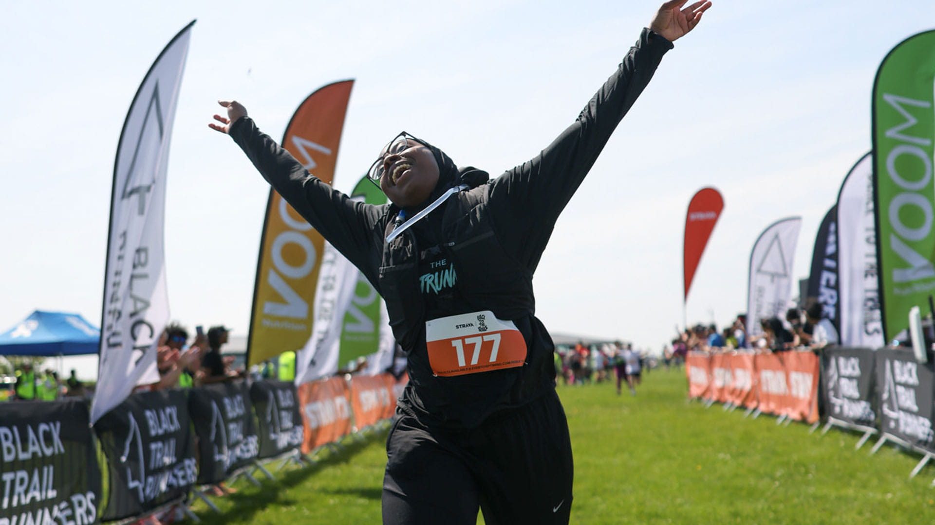 Black To The Trails participant crosses the Finish Line in style