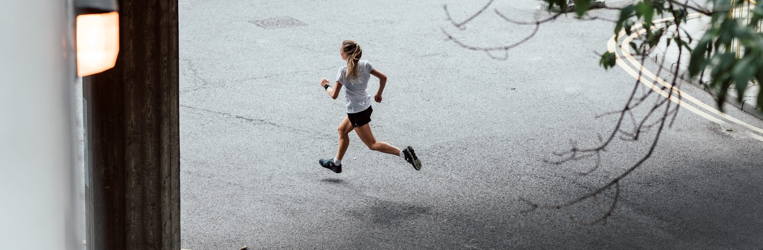 A woman runs through the streets of London