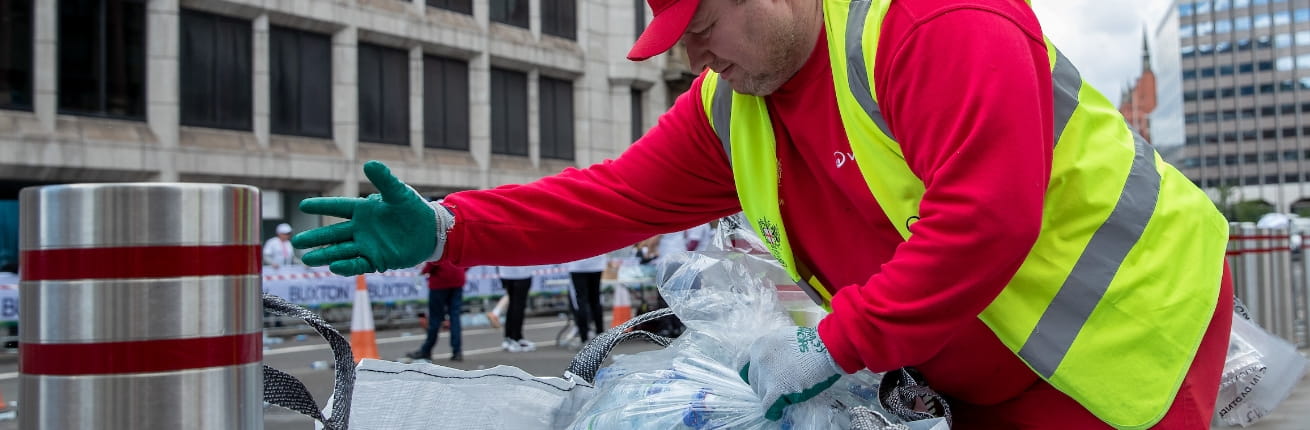 Workers recycling plastic Buxton water bottles in the City of London
