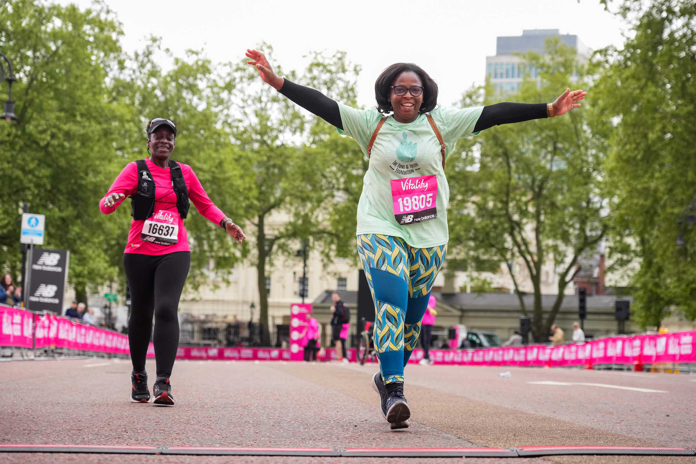 Participants celebrate at the Vitality London 10,000