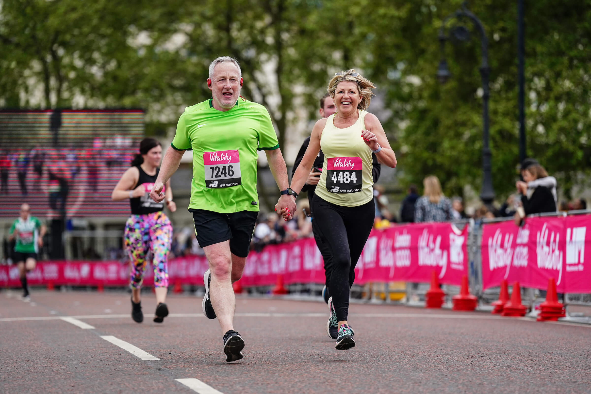 Participants holding hands at the Vitality London 10,000