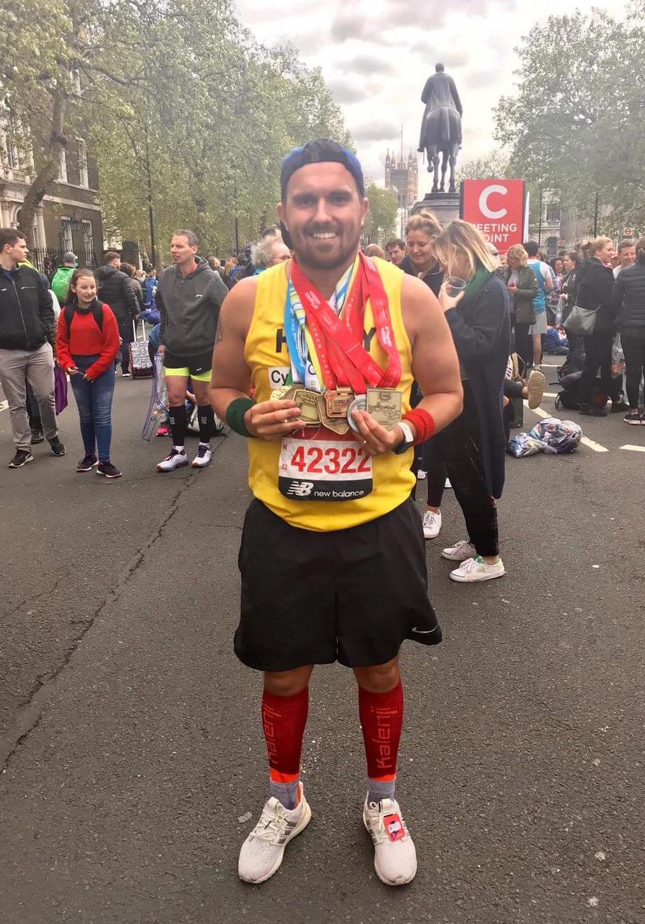 A charity runner at the Finish Line of the TCS London Marathon