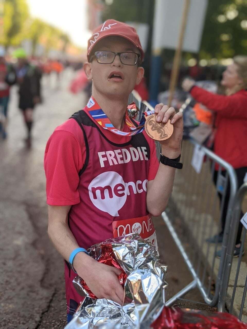 A charity participant for Mencap with a London Marathon medal