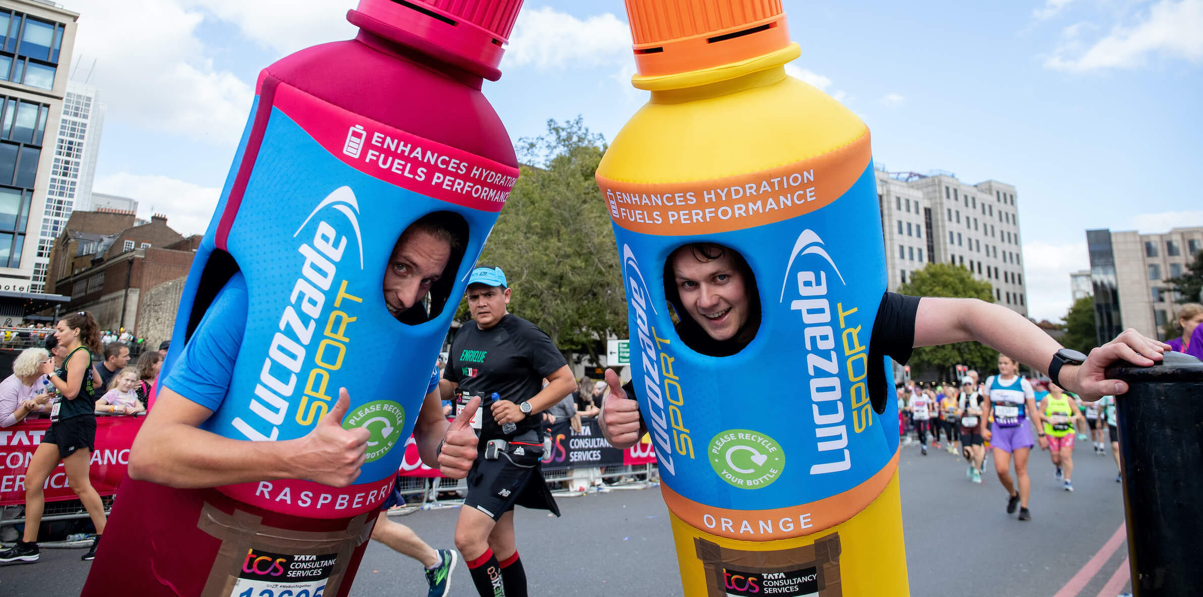 Two participants dressed as Lucozade Sport bottles at the TCS London Marathon
