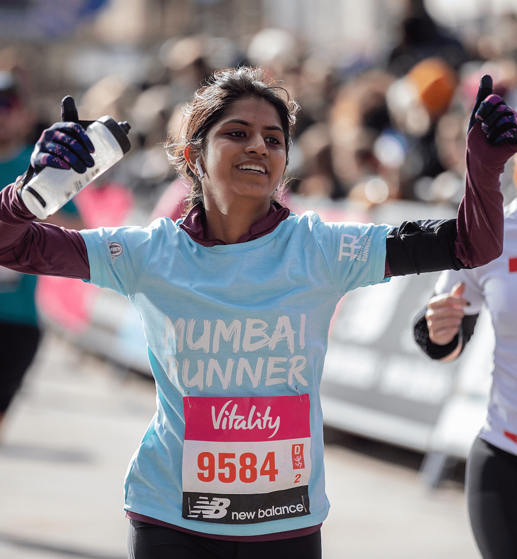 A runner crossing the Finish Line at The Vitality Big Half