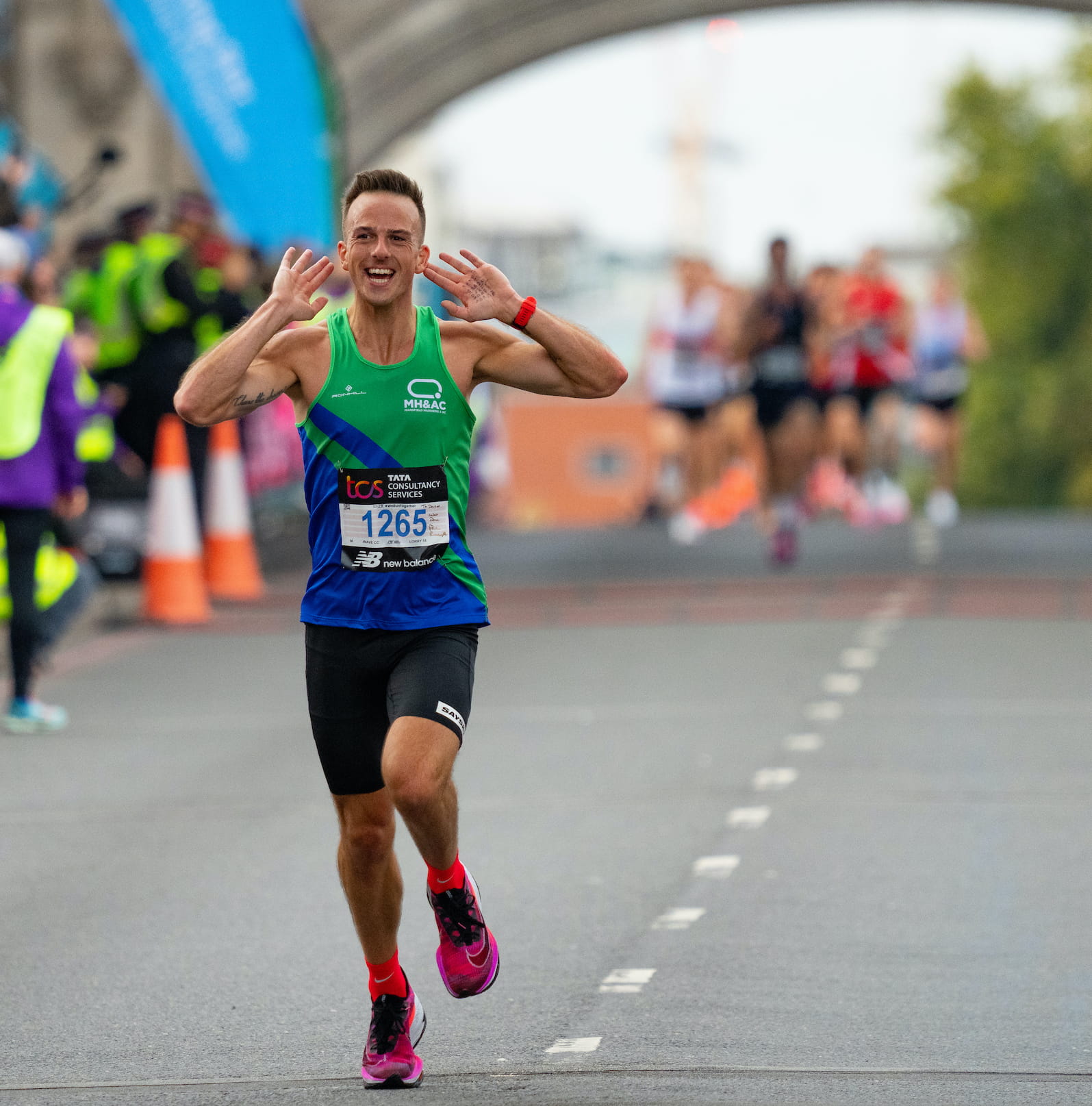 A participant crosses Tower Bridge at the TCS London Marathon