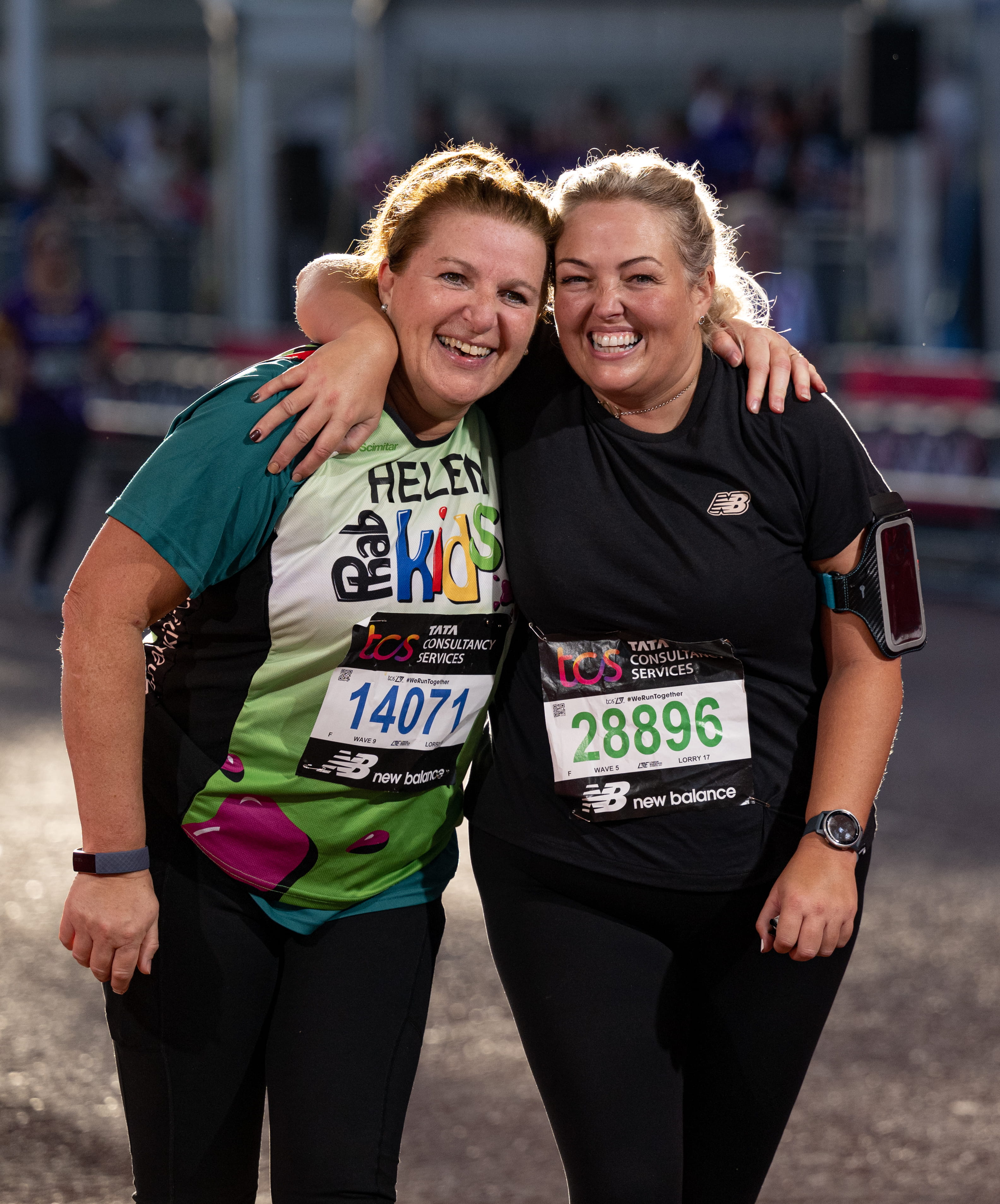 Two smiling participants at the TCS London Marathon