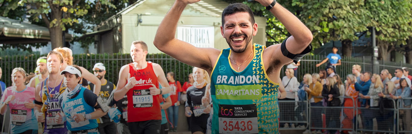 Samaritans charity runner celebrating at the TCS London Marathon