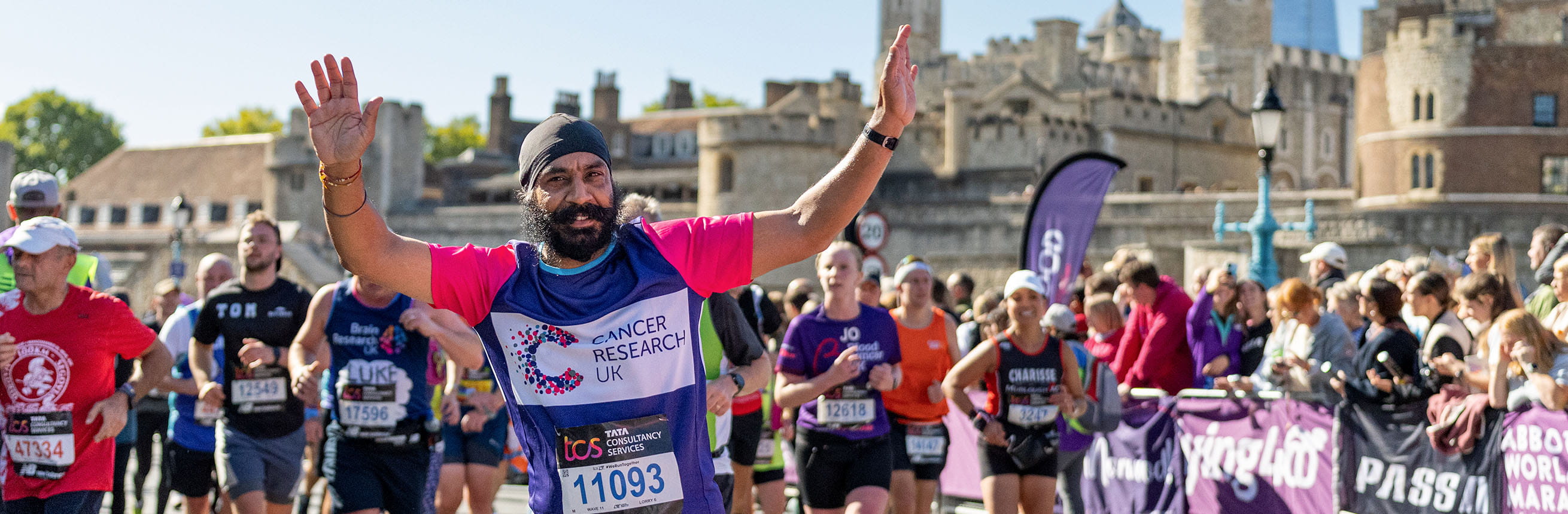 TCSLM 2022 charity runner with Tower of London in the background