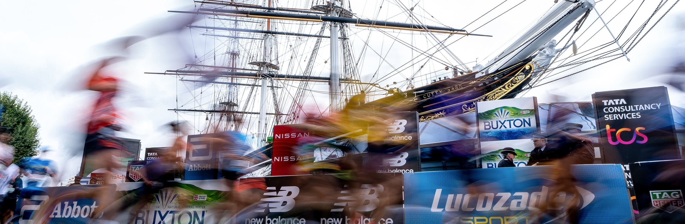 Runners pass Cutty Sark at the TCS London Marathon