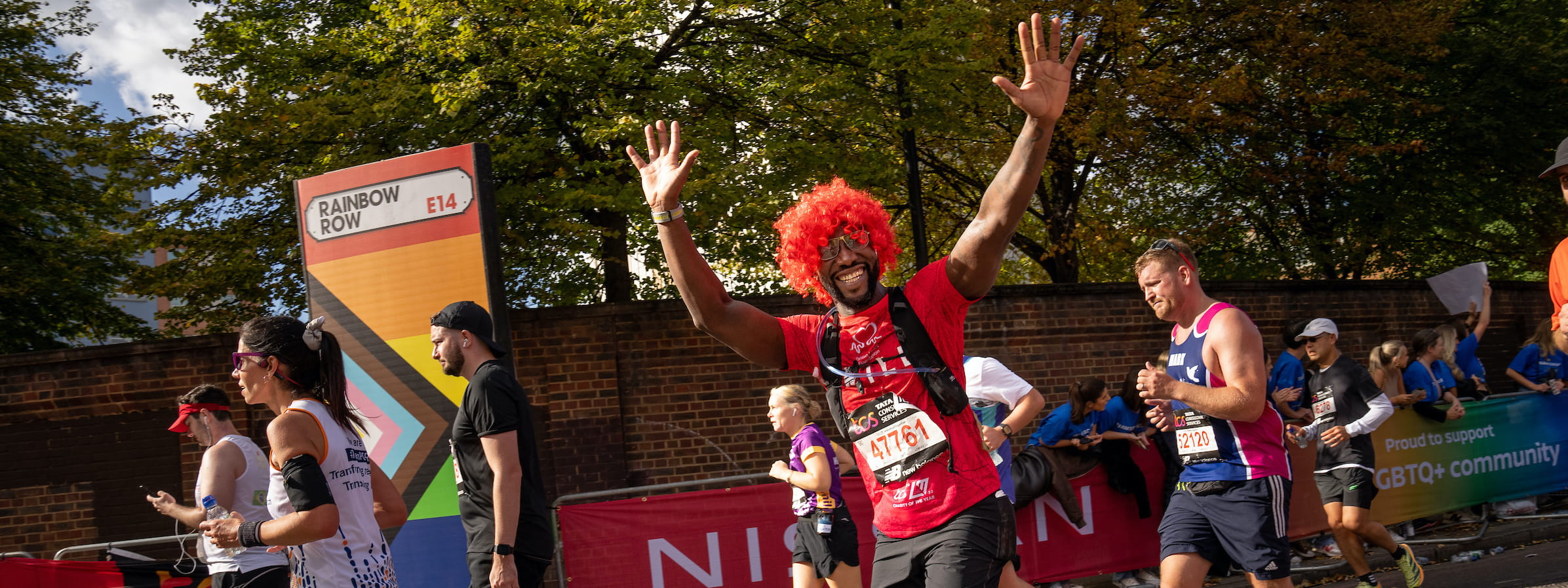 A TCS London Marathon participant with their hands in the air