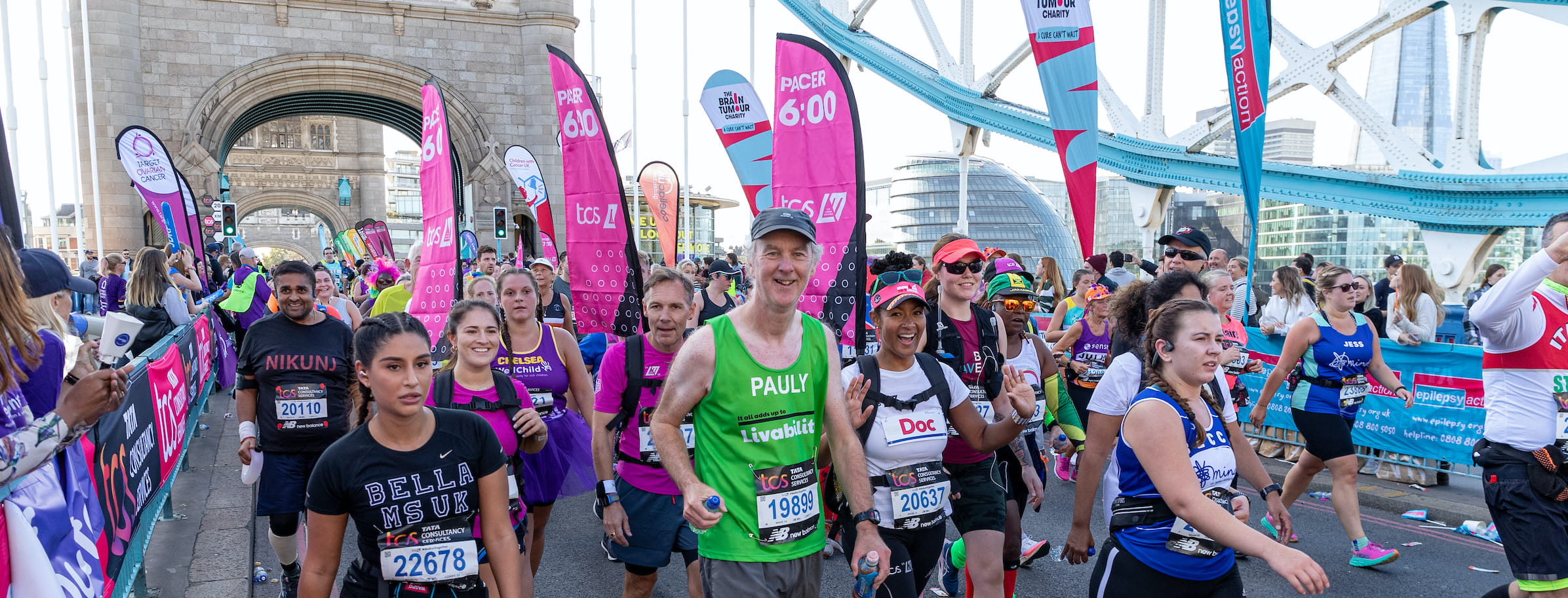 Pacers and participants cross Tower Bridge during the TCS London Marathon