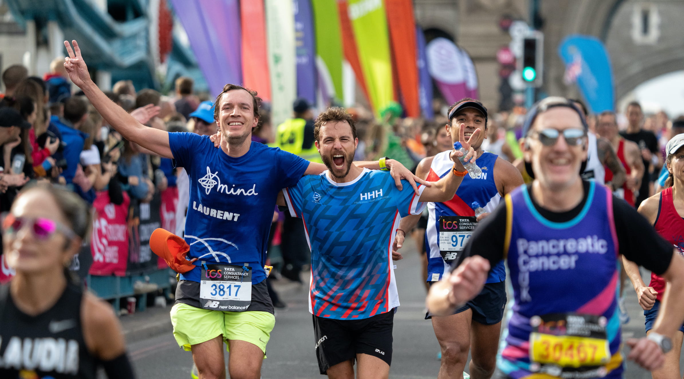 Runners cross Tower Bridge at the TCS London Marathon