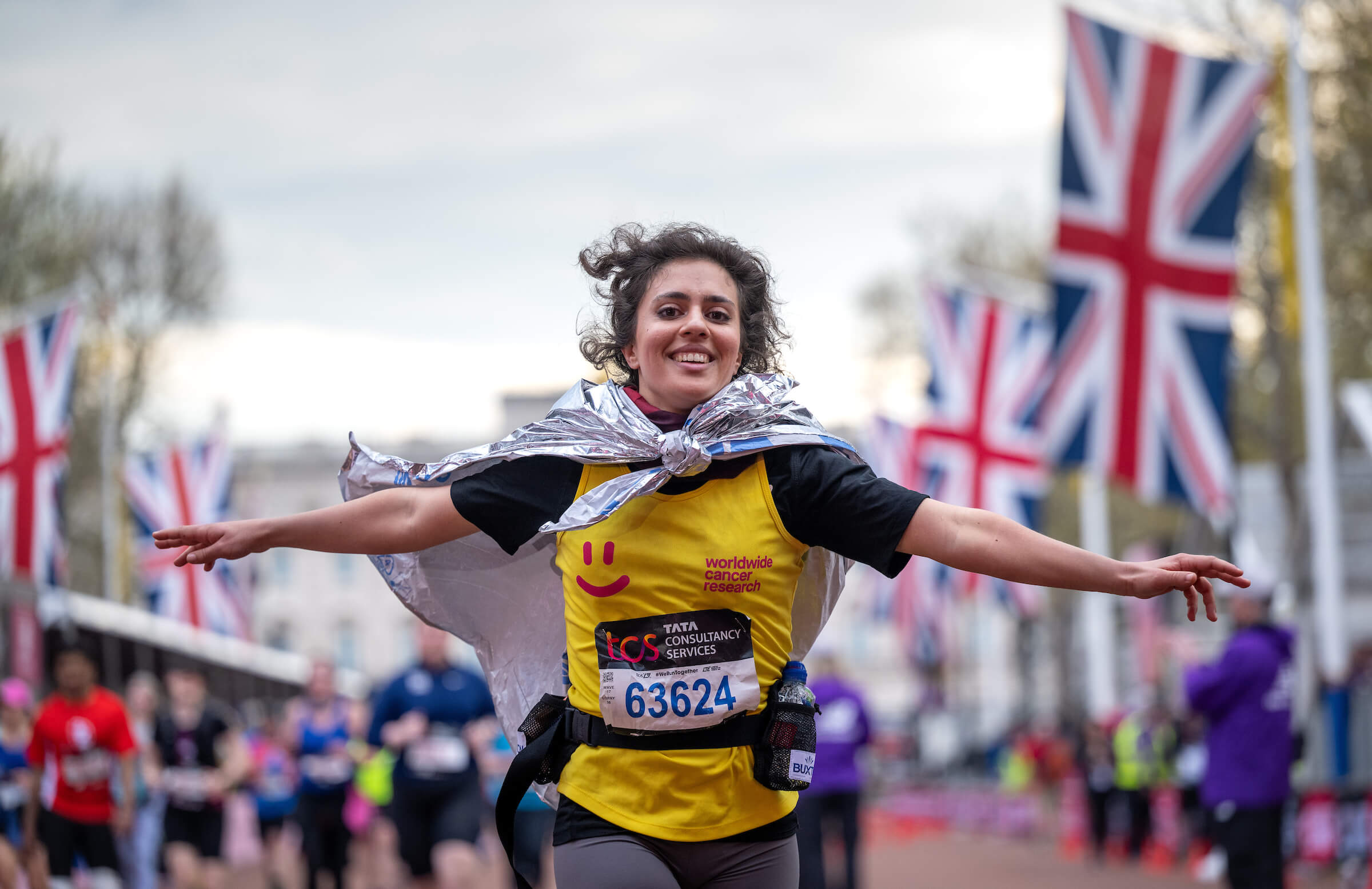 A TCS London Marathon participant runs down The Mall