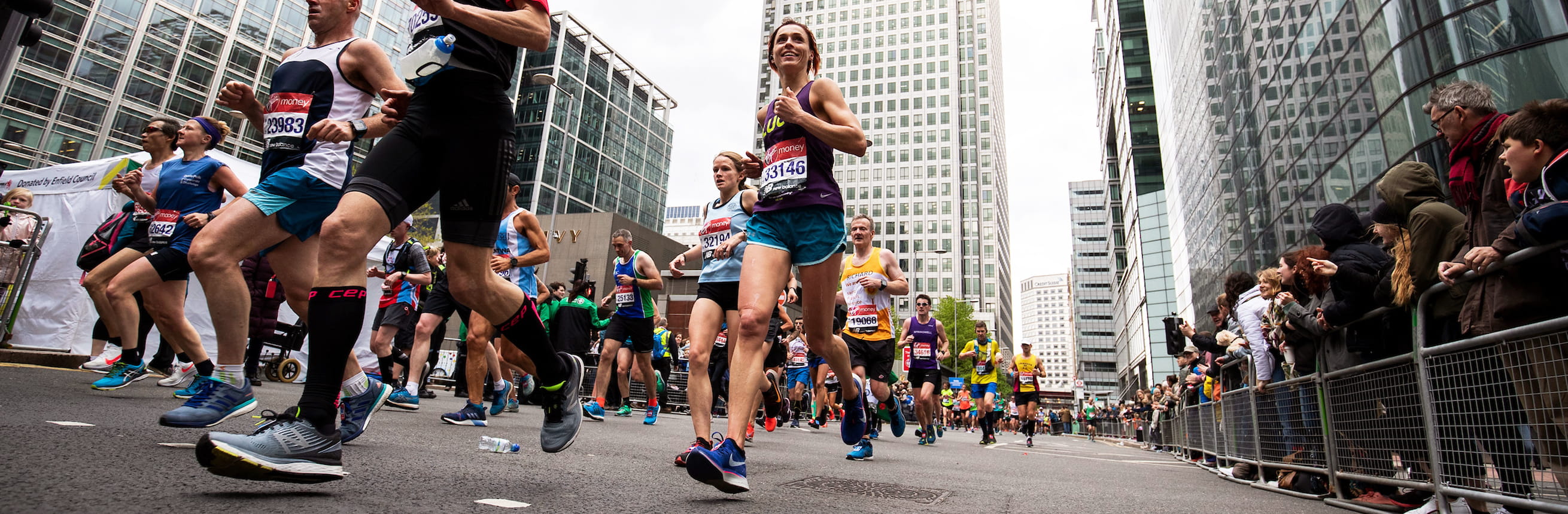Runner passes through Canary Wharf on marathon day