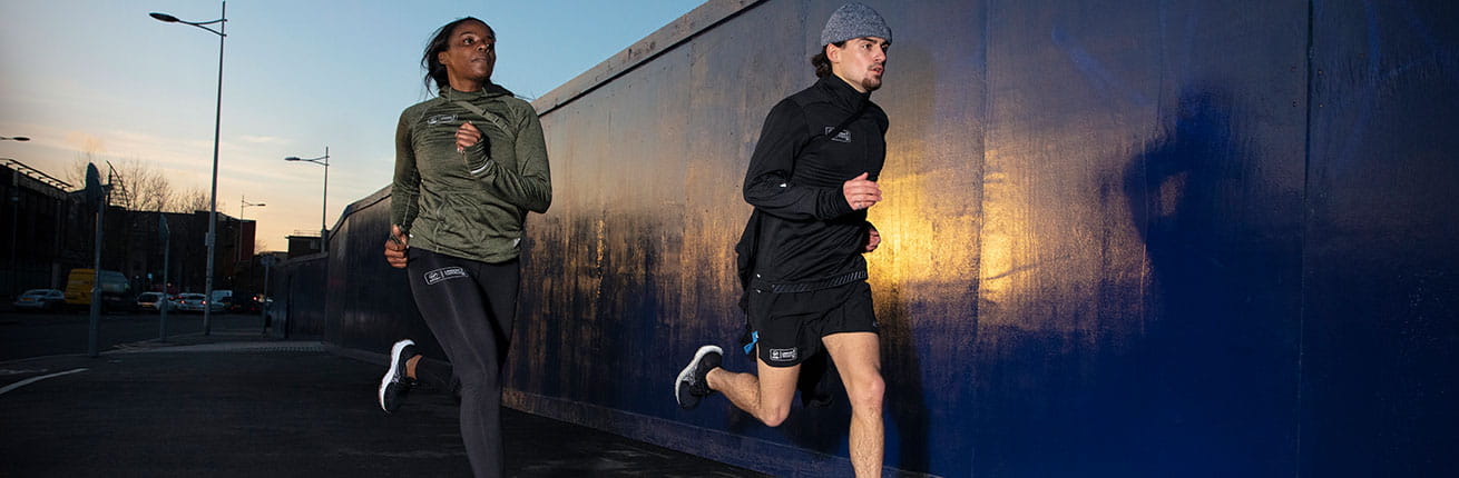 Two runners train in their New Balance kit