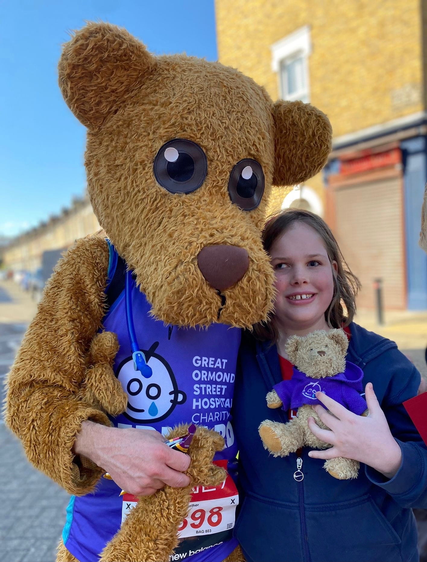 Girl with a GOSH Charity mascot