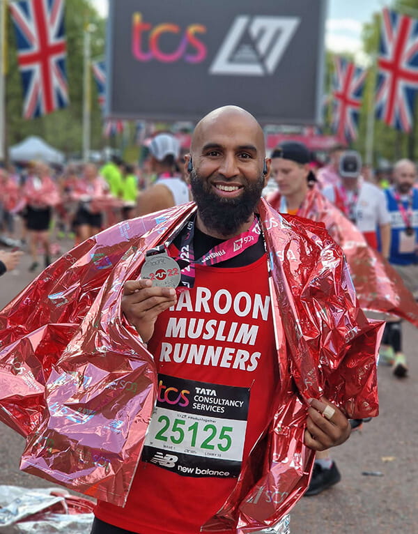 Haroon Mota with medal at the TCS London Marathon finish