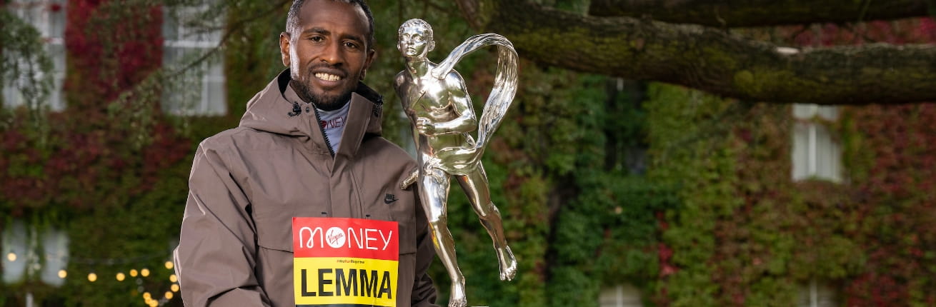 Sisay Lemma (ETH) poses with the Sporting Life Chris Brasher Trophy after winning the Elite Men&#x2019;s Race at the 2021 TCS London Marathon