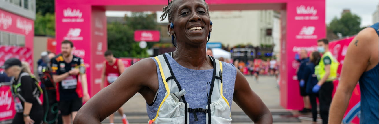 A 2021 Vitality Big Half runner is all smiles after completing the race