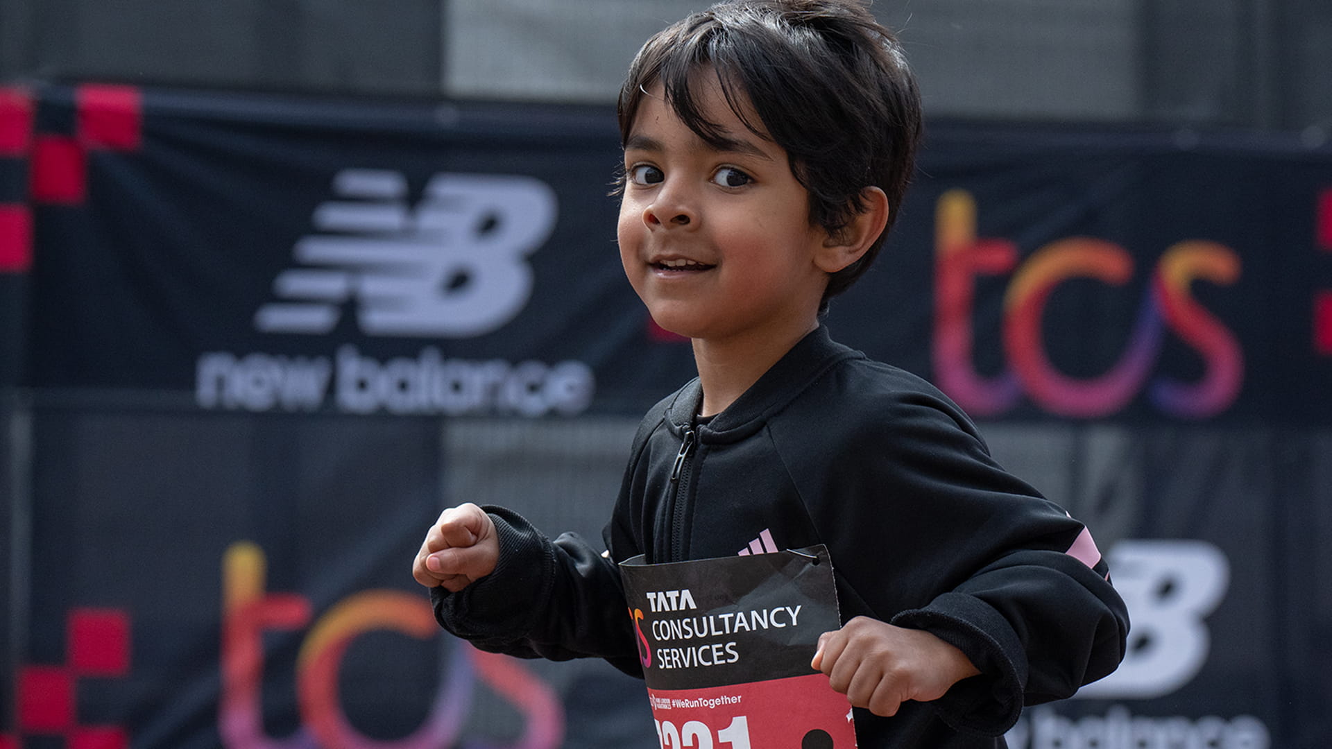 A young participant heads towards the finish line on The Mall