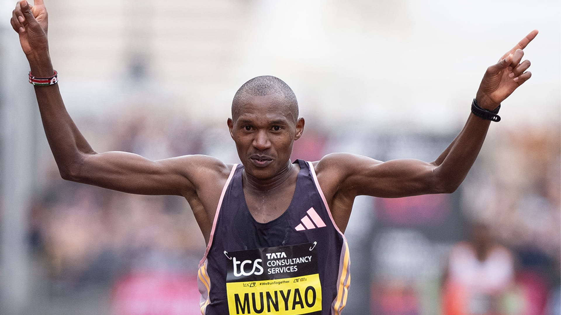 Munyao crossing the Finish Line