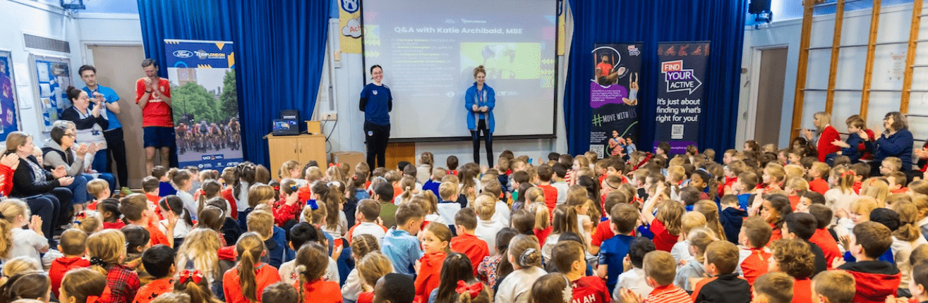 Olympic Champion Katie Archibald talking to a school assembly 
