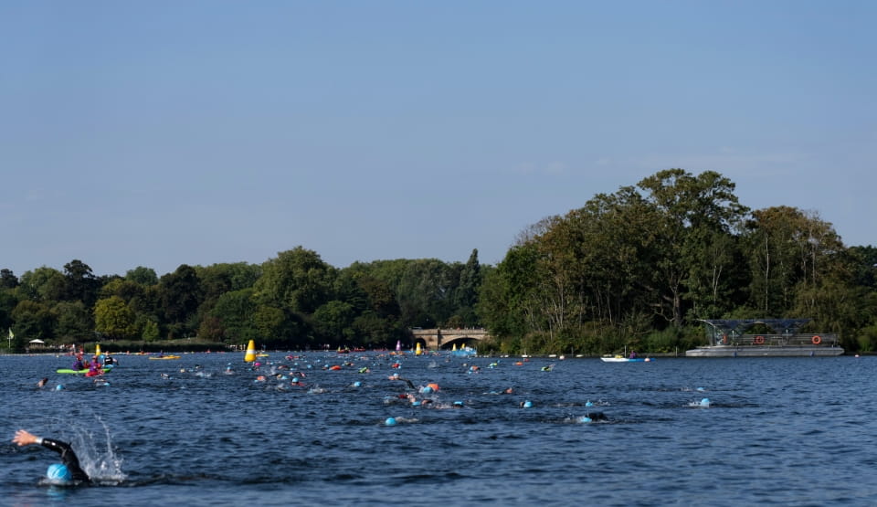 A view of the Serpentine with swimmers taking part in the event
