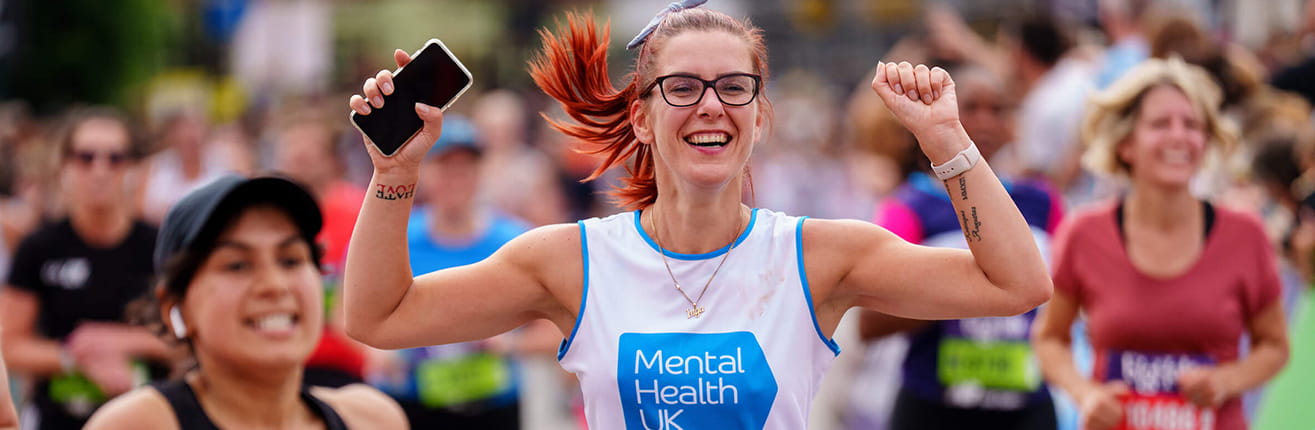 An enthusiastic woman running for a charity at the Big Half