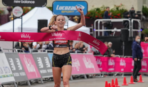 Charlotte Purdue crosses the finish line at the Vitality Big Half 2021